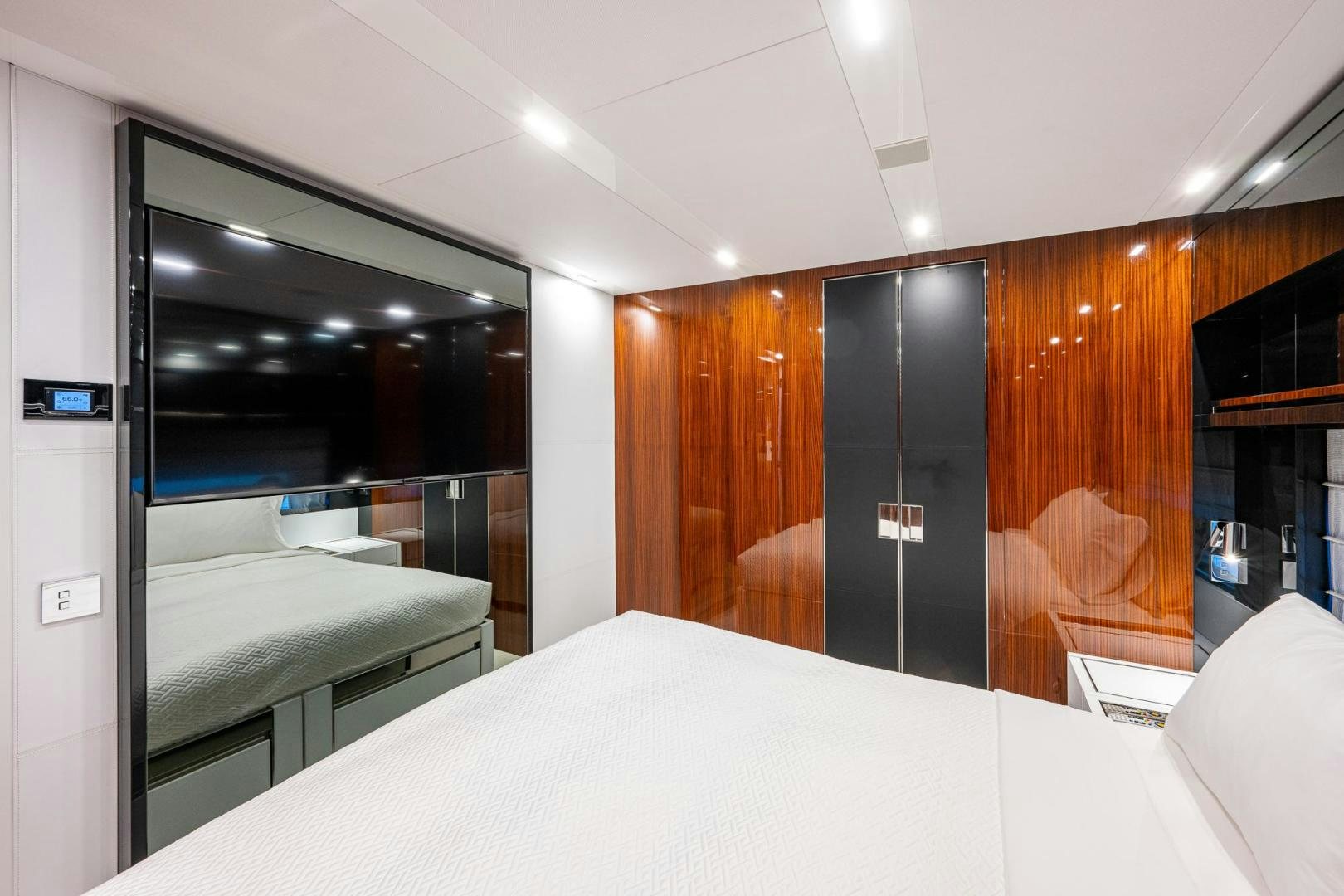 a room with a bed and a closet aboard LISOLO Yacht for Sale