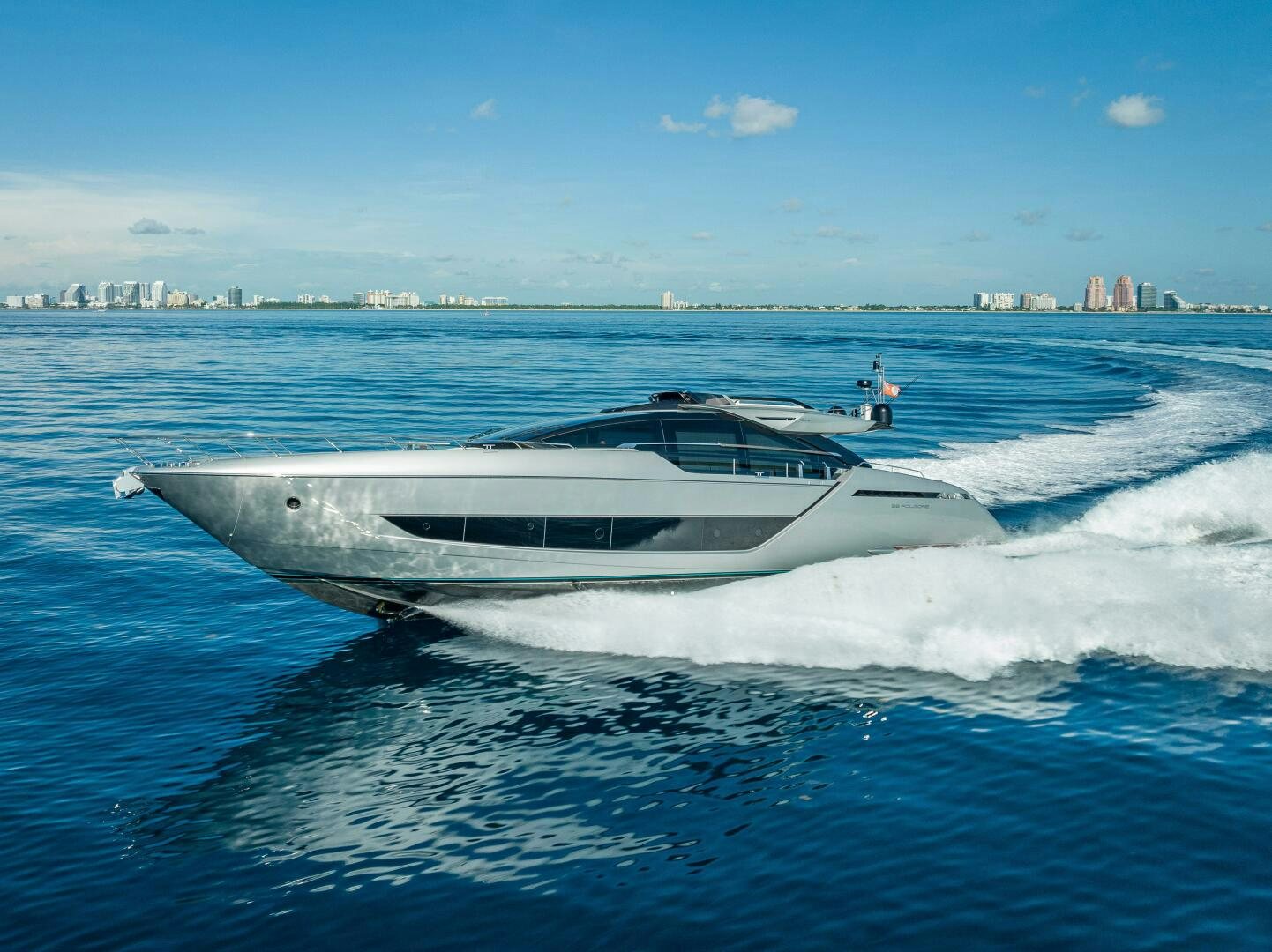 a white yacht in the water aboard LISOLO Yacht for Sale