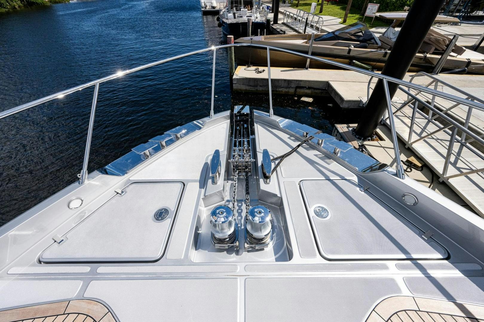 a white boat with a blue front aboard LISOLO Yacht for Sale