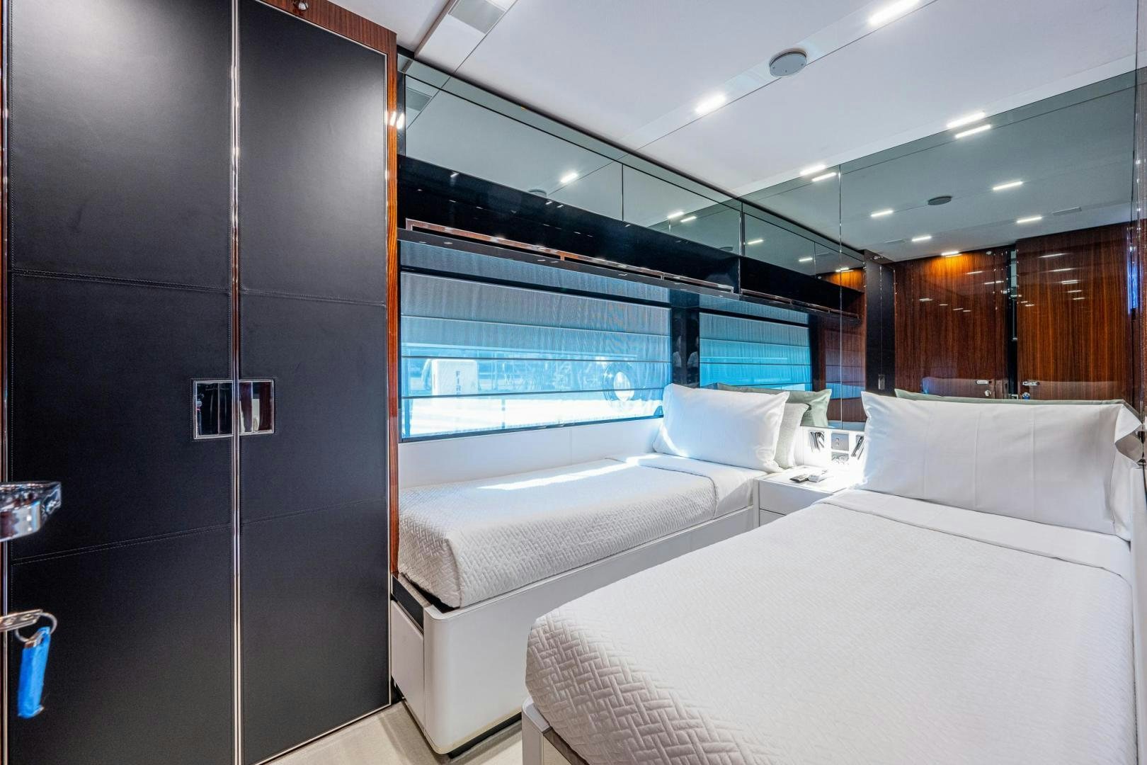 a room with a bed and a window aboard LISOLO Yacht for Sale