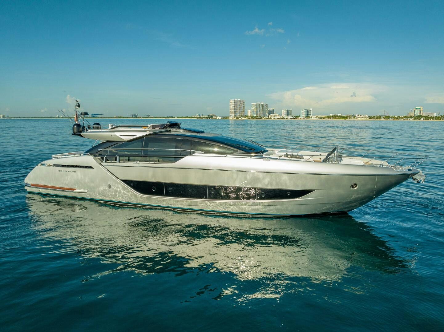 a white boat on the water aboard LISOLO Yacht for Sale