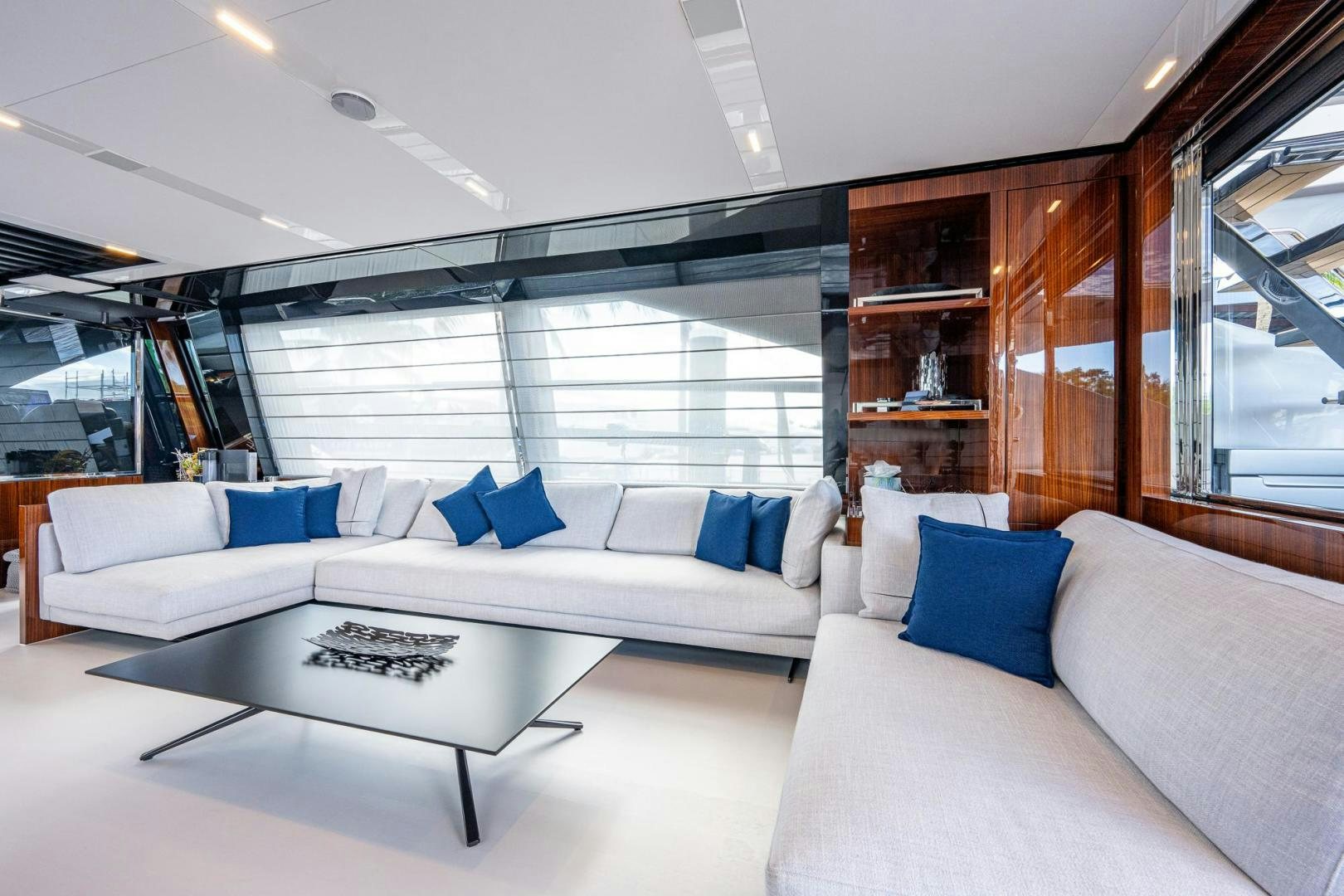 a living room with a couch and a table aboard LISOLO Yacht for Sale