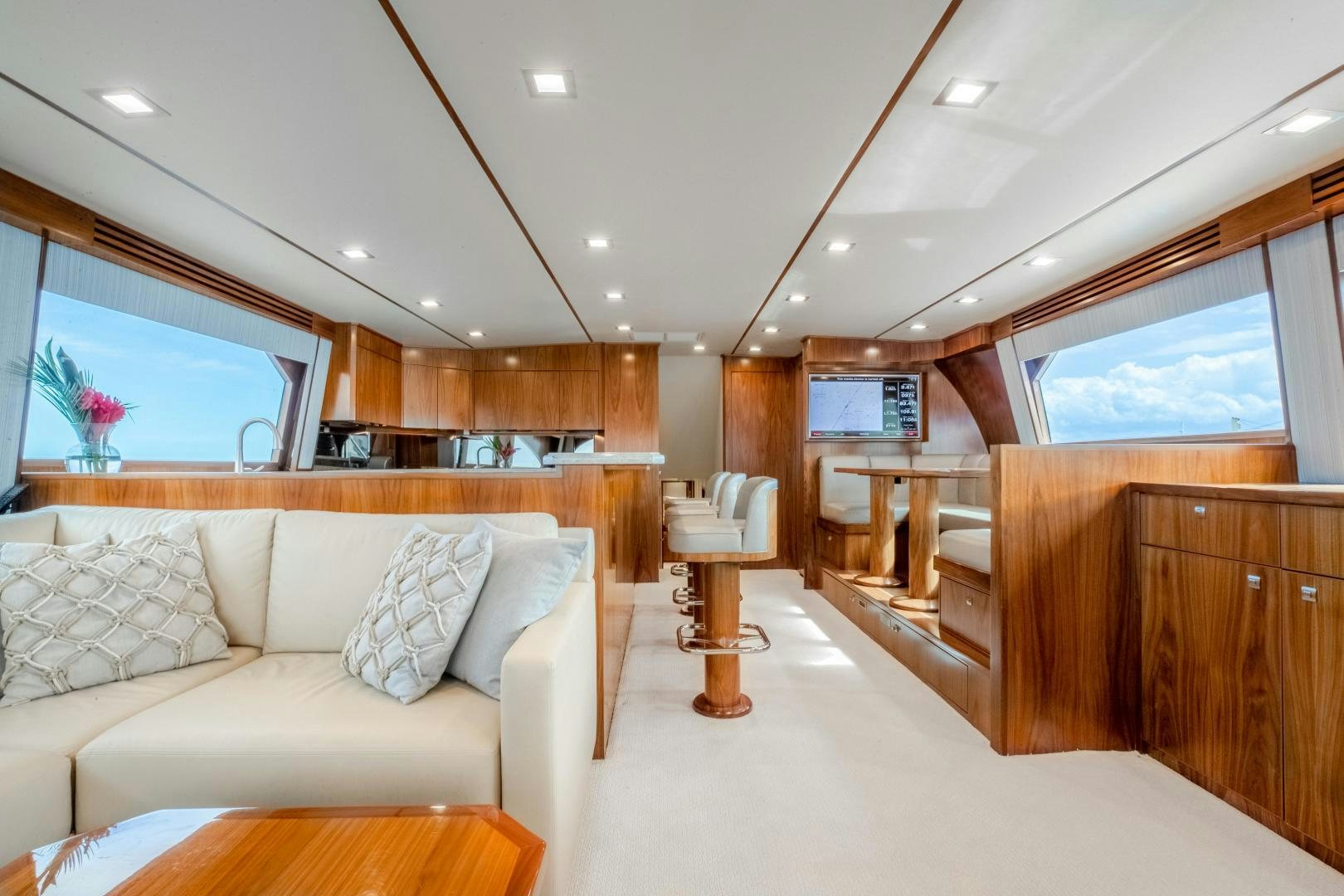 a living room with a couch and a table aboard POMPINA Yacht for Sale