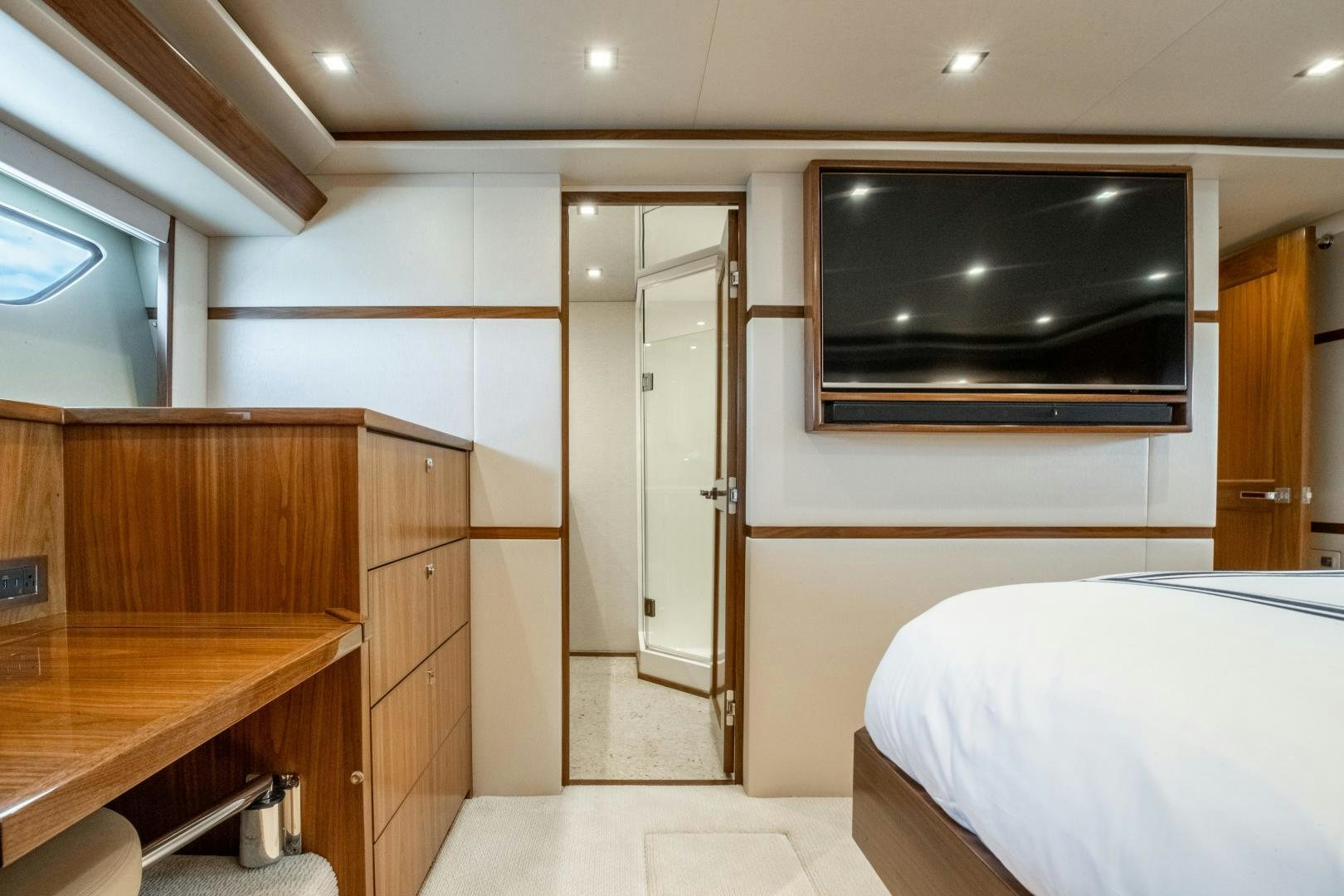 a room with a bed and a tv aboard POMPINA Yacht for Sale