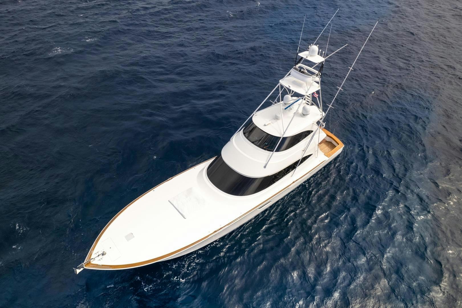 a white boat in the water aboard POMPINA Yacht for Sale