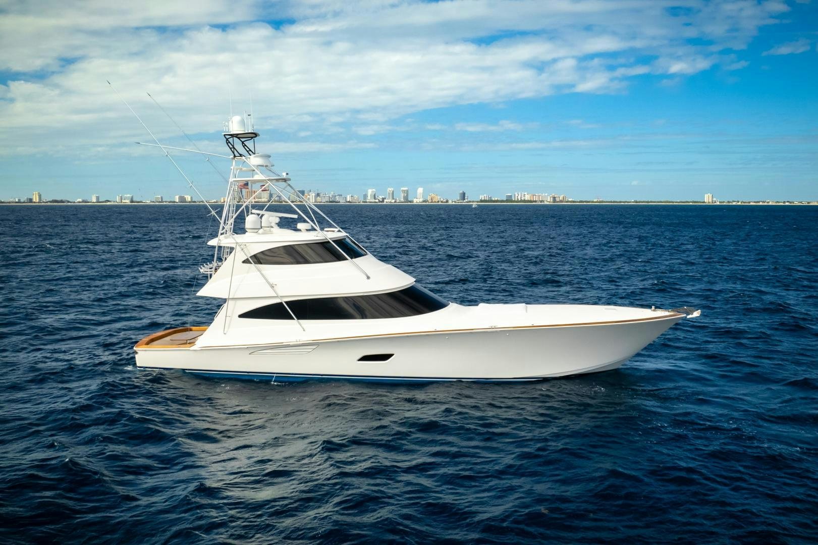 a white yacht in the water aboard POMPINA Yacht for Sale