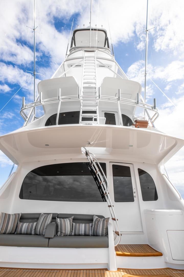 a white boat with a ladder aboard POMPINA Yacht for Sale