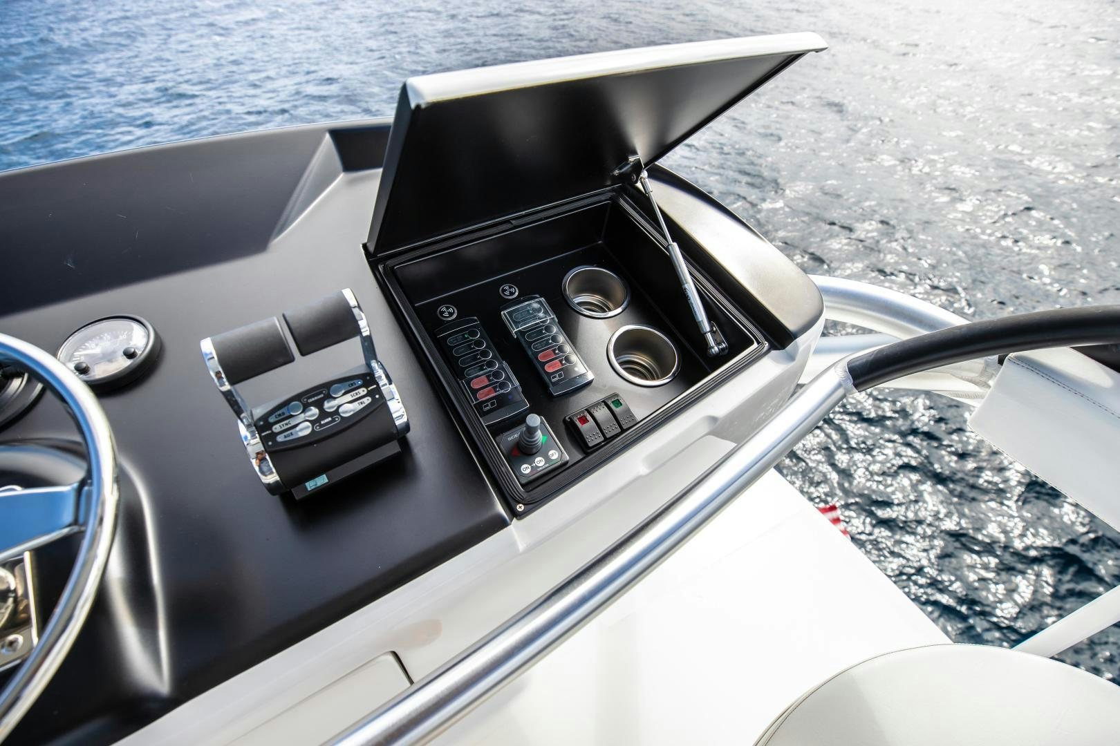 a steering wheel and dashboard of a car aboard POMPINA Yacht for Sale