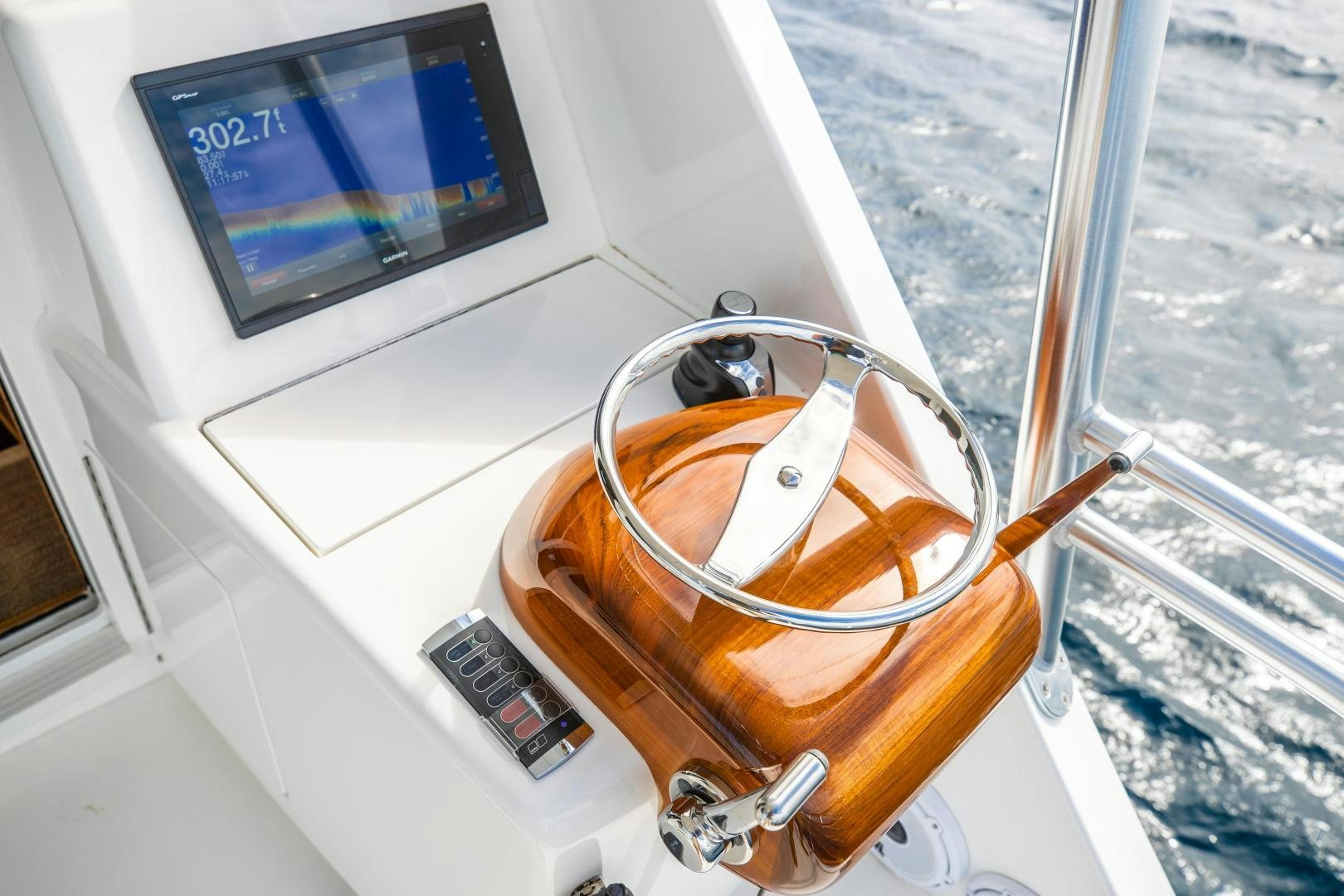a glass cup on a window sill aboard POMPINA Yacht for Sale