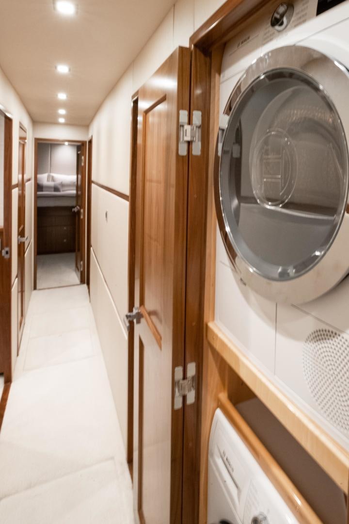 a hallway with a large mirror aboard POMPINA Yacht for Sale