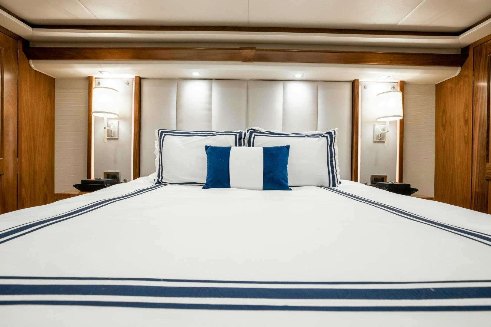 a bed with white sheets aboard POMPINA Yacht for Sale
