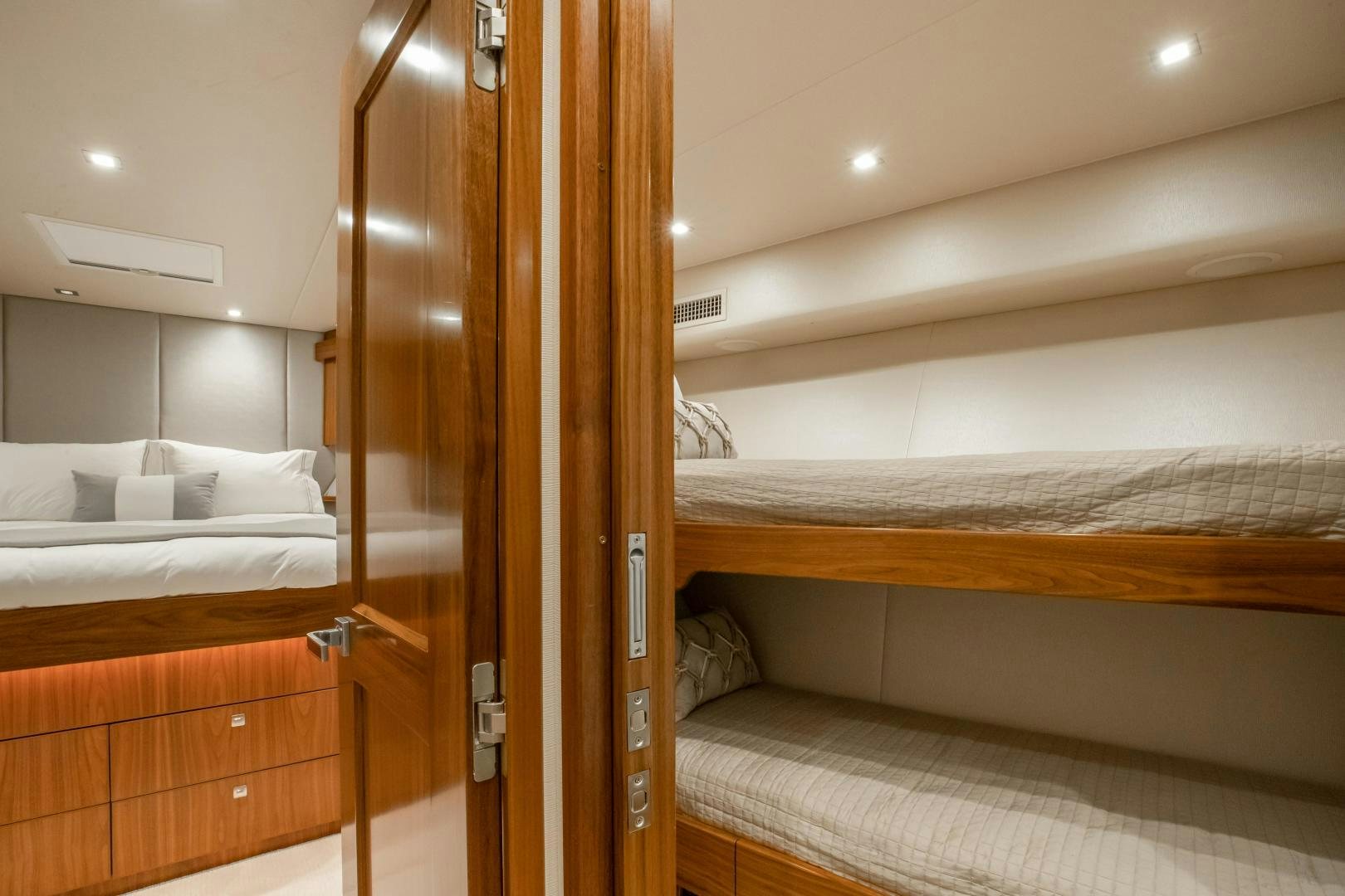 a room with bunk beds aboard POMPINA Yacht for Sale
