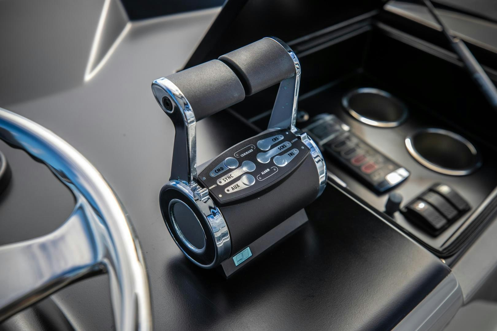 a car steering wheel and dashboard aboard POMPINA Yacht for Sale