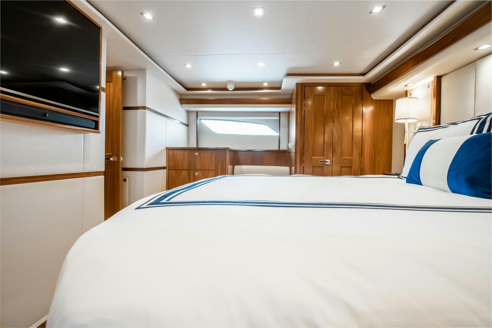 a room with a bed and a tv aboard POMPINA Yacht for Sale