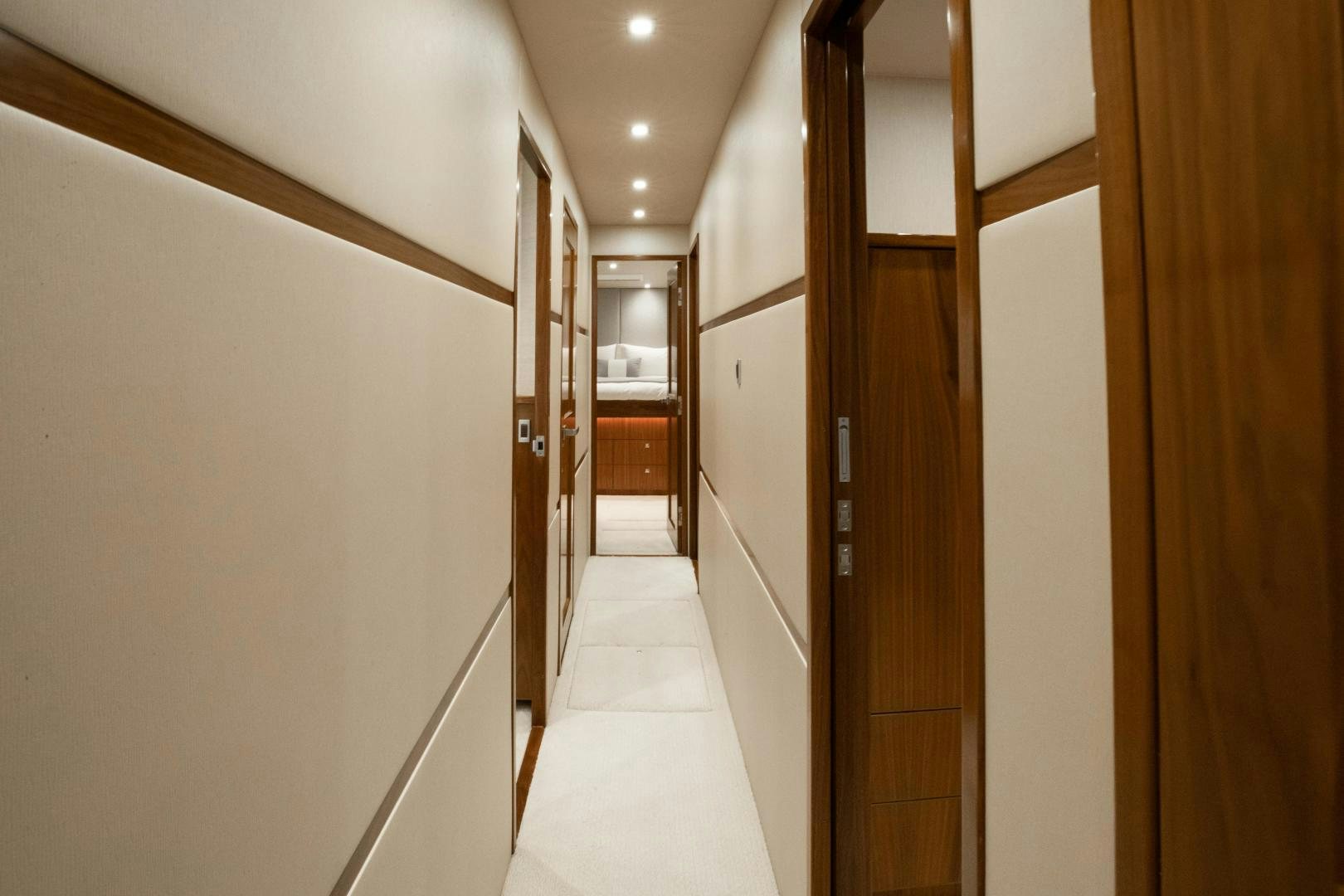 a hallway with doors aboard POMPINA Yacht for Sale