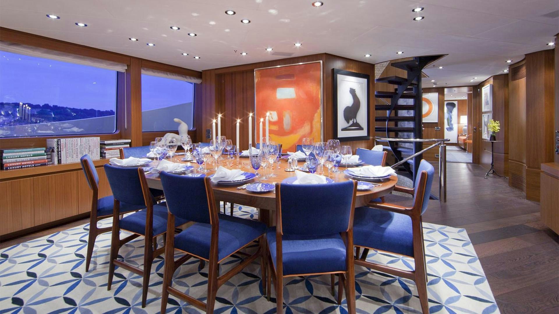 a dining room with a table set for dinner aboard SNOWBIRD Yacht for Sale