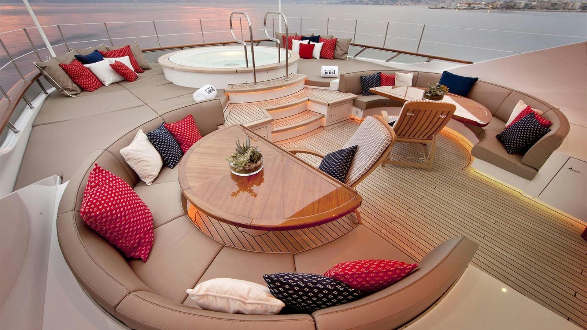 a living room with a large patio aboard SNOWBIRD Yacht for Sale