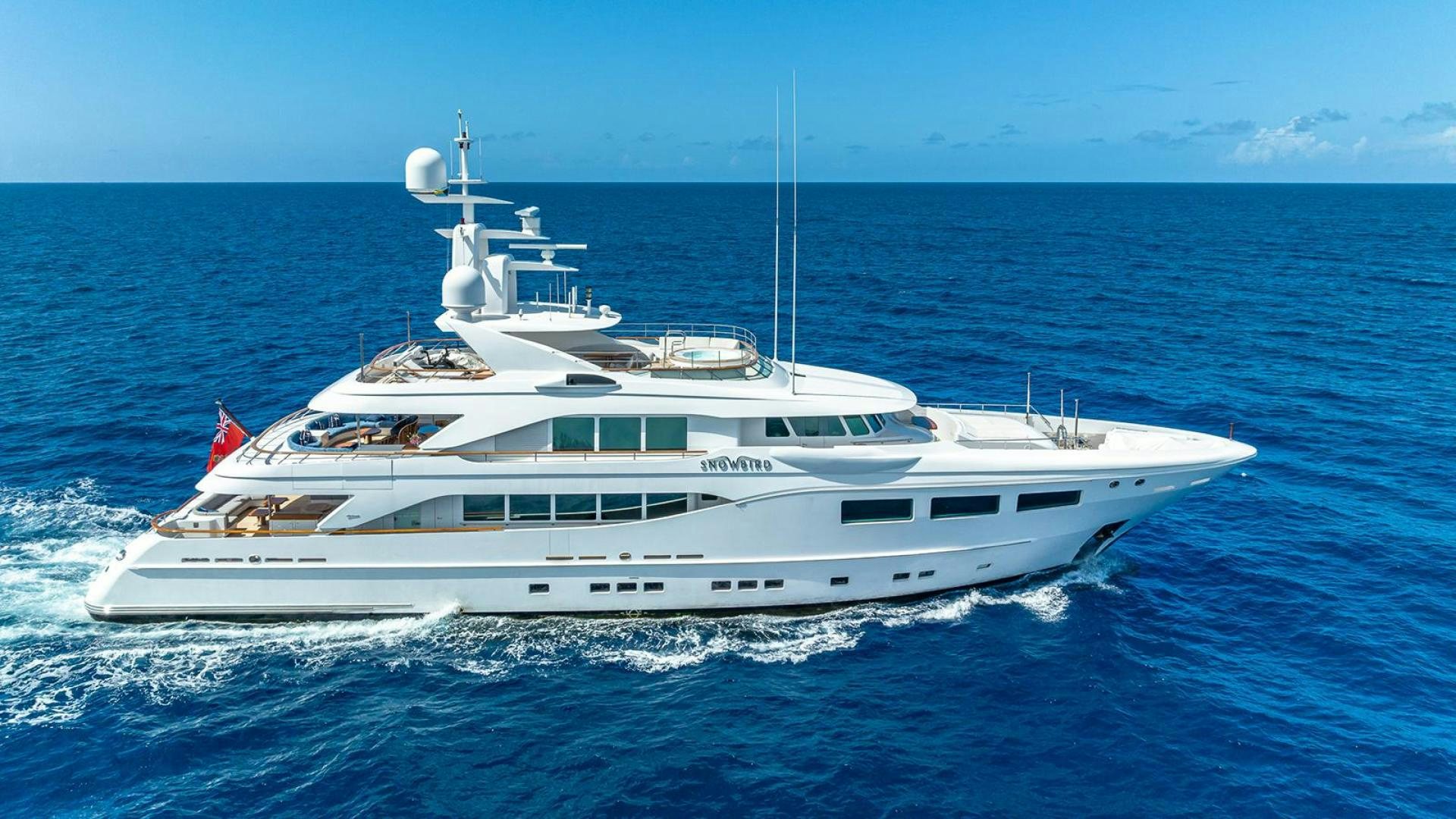 a white yacht on the water aboard SNOWBIRD Yacht for Sale