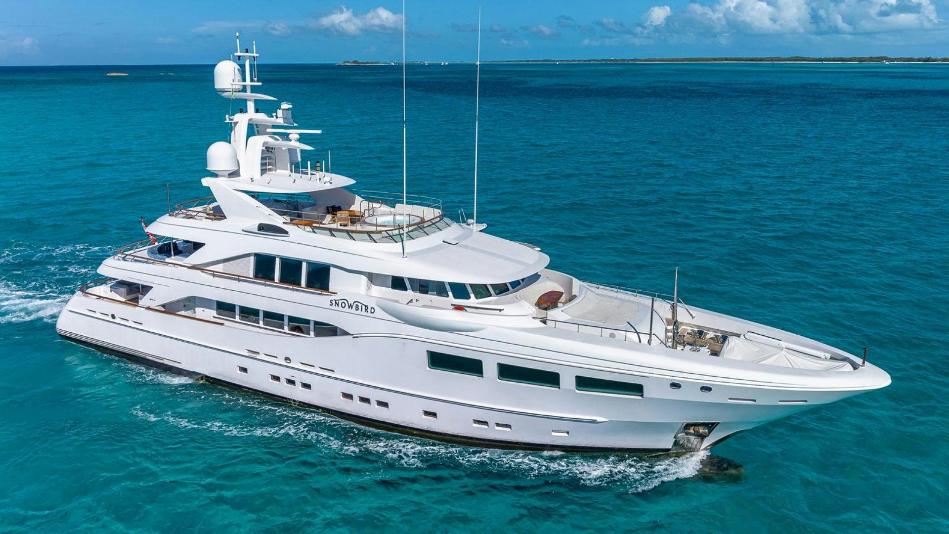 a white yacht in the water aboard SNOWBIRD Yacht for Sale