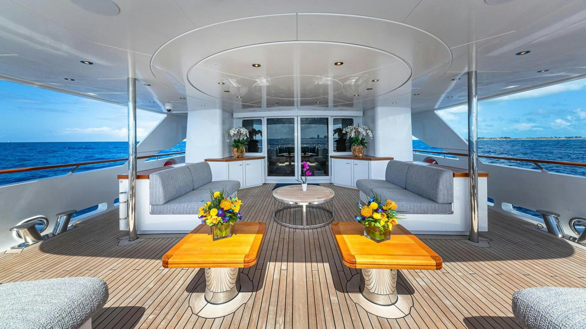 a living room with a large window aboard SNOWBIRD Yacht for Sale