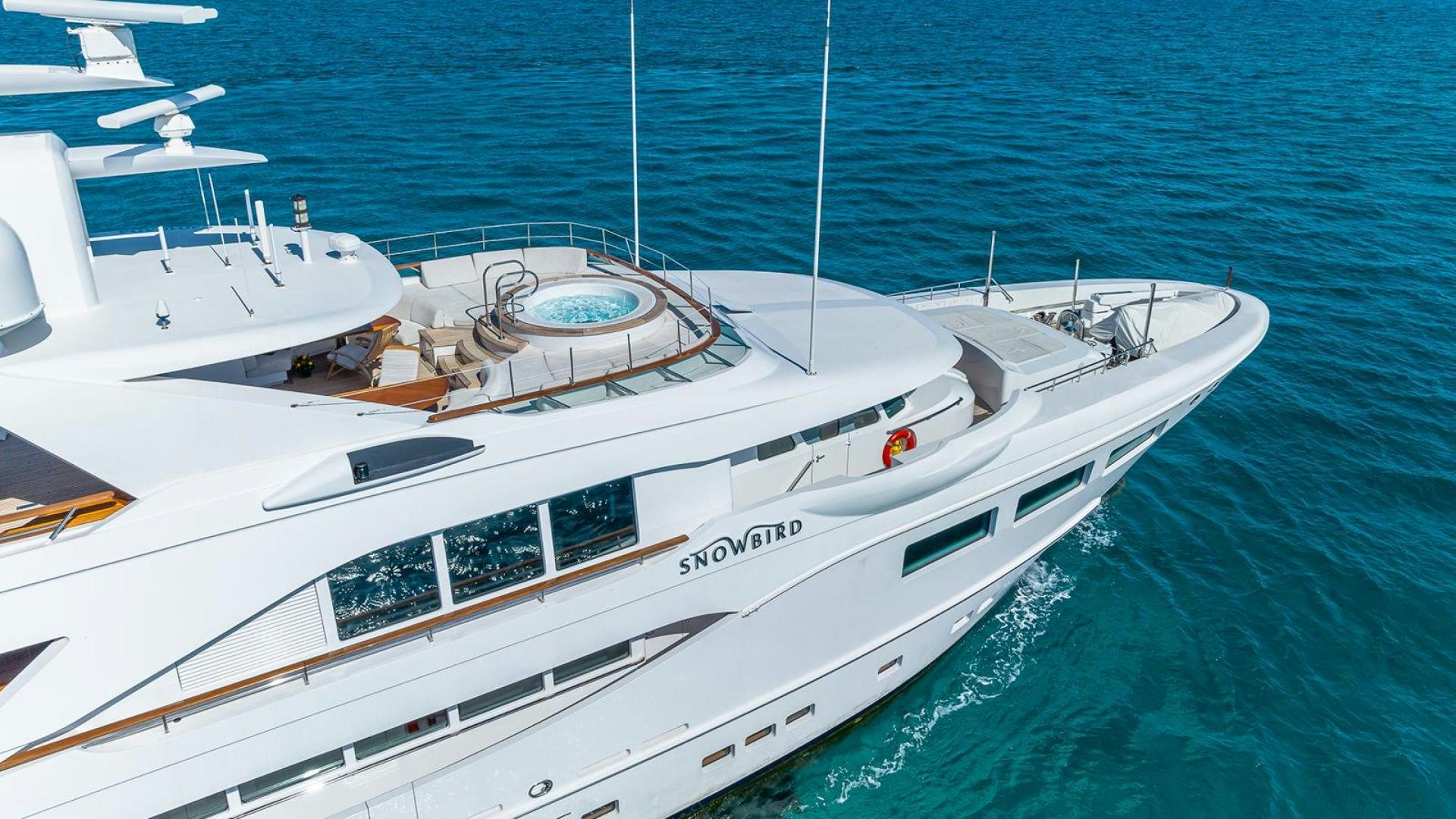 a white yacht in the water aboard SNOWBIRD Yacht for Sale