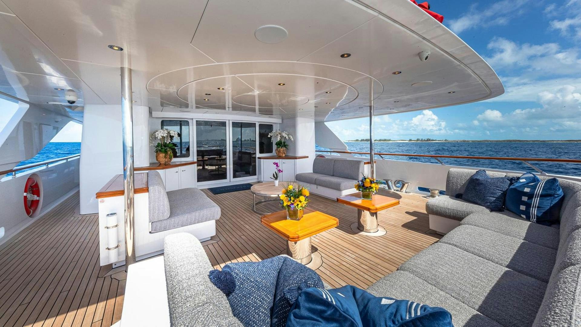 a living room with a large window aboard SNOWBIRD Yacht for Sale