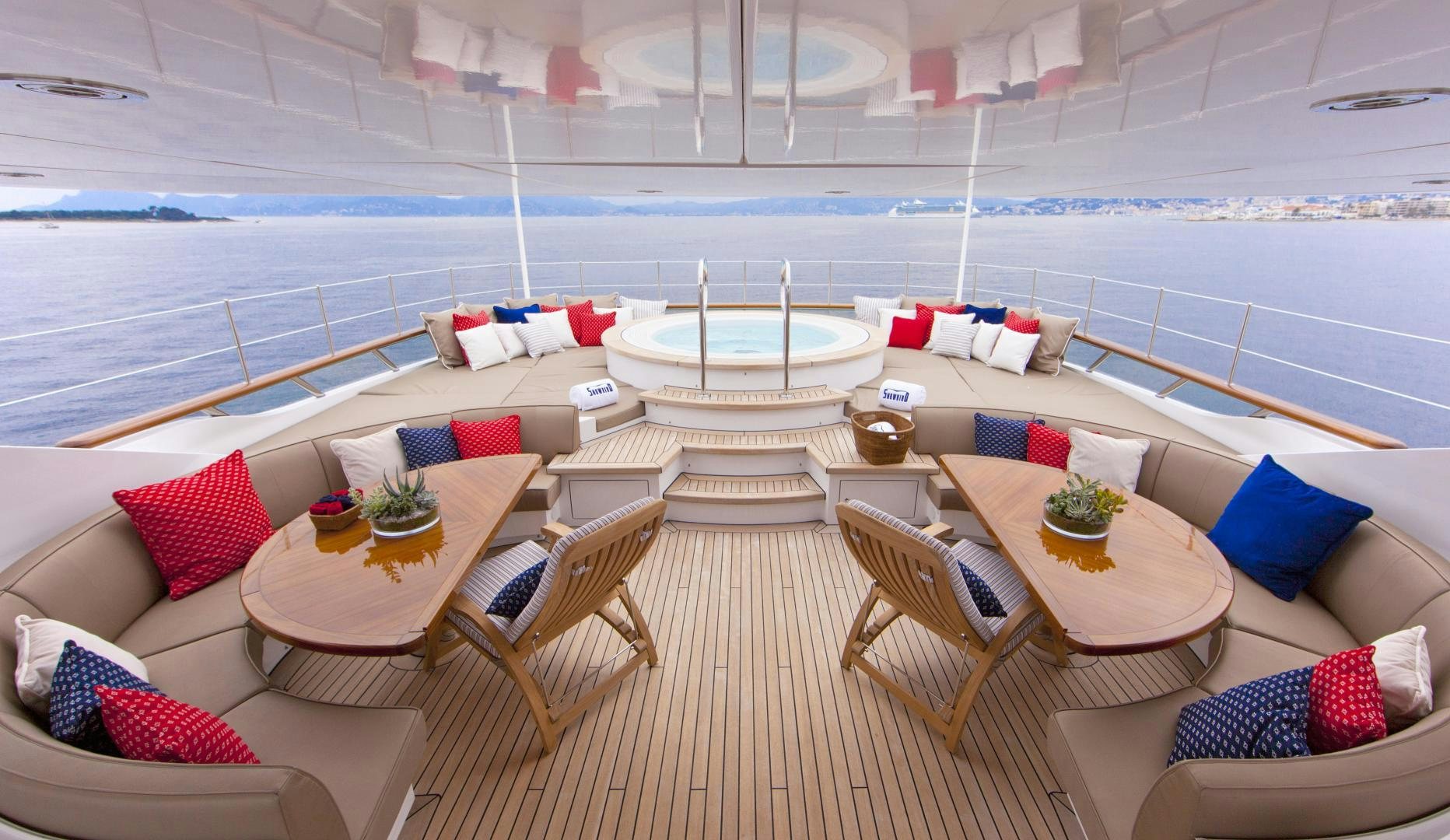 a room with a table chairs and a large body of water aboard SNOWBIRD Yacht for Sale
