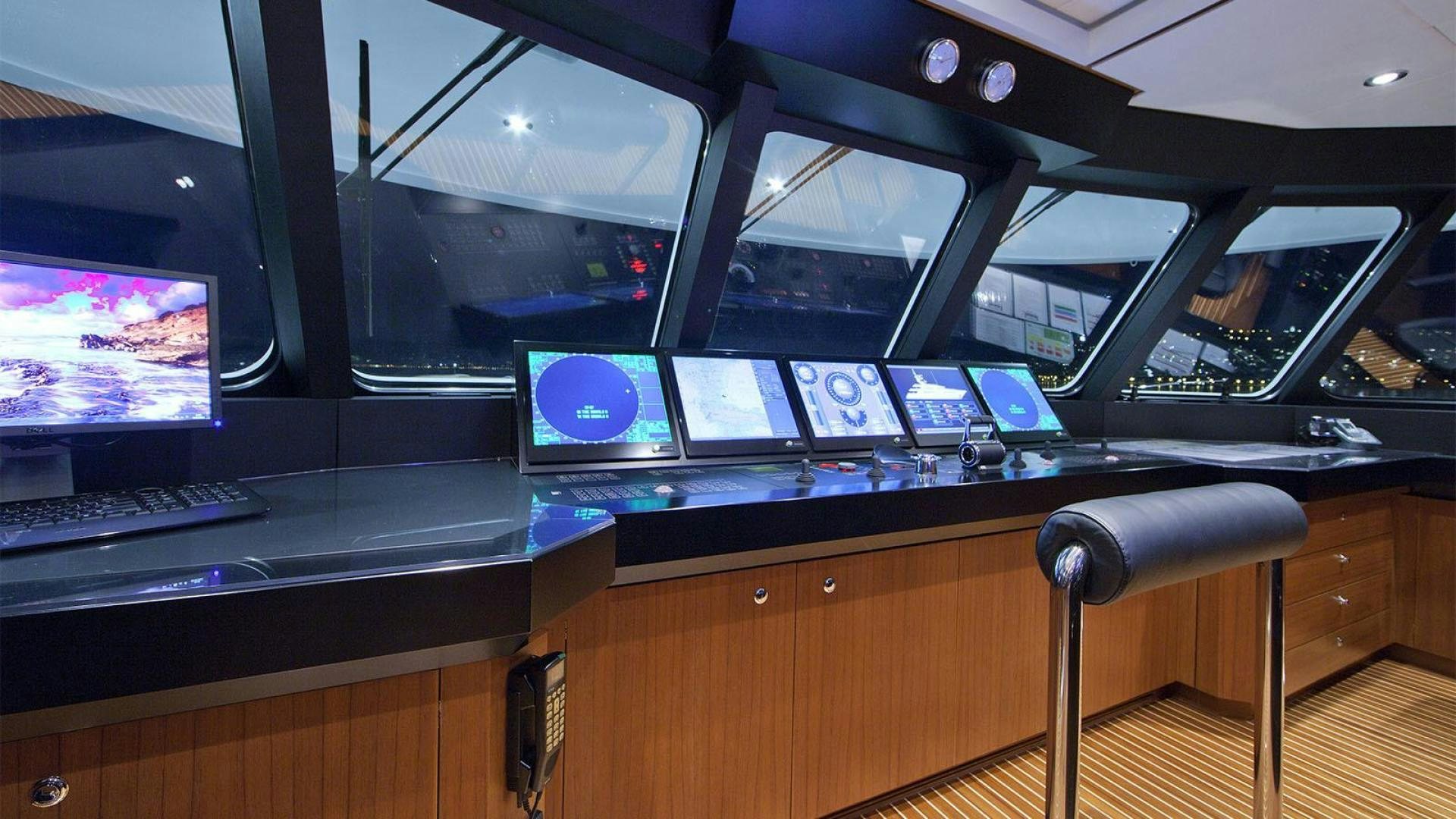 a room with computers and monitors aboard SNOWBIRD Yacht for Sale