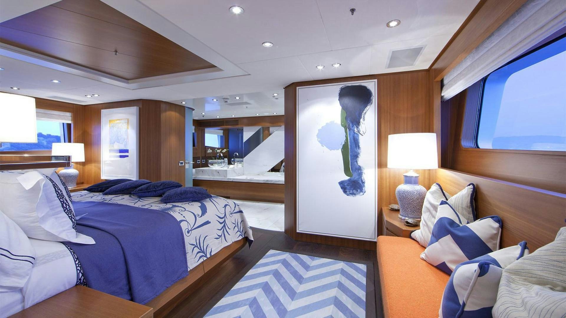 a room with a bed and a mirror aboard SNOWBIRD Yacht for Sale