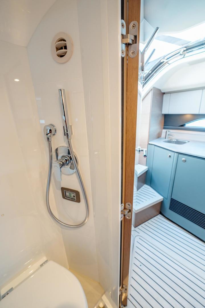 a bathroom with a shower and a toilet aboard PR35 Yacht for Sale