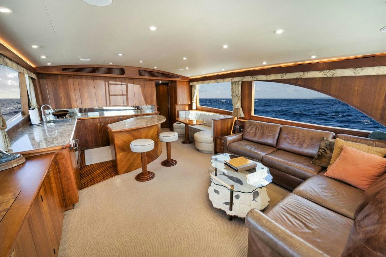 a living room with a large bed aboard Gina Lisa Yacht for Sale