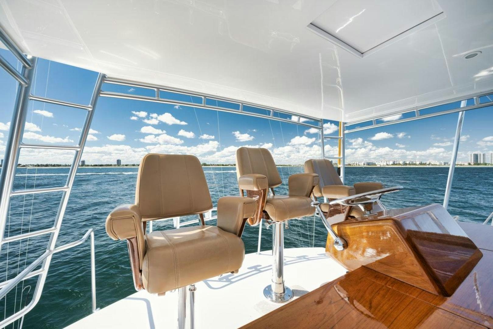 a boat with chairs on it aboard Gina Lisa Yacht for Sale
