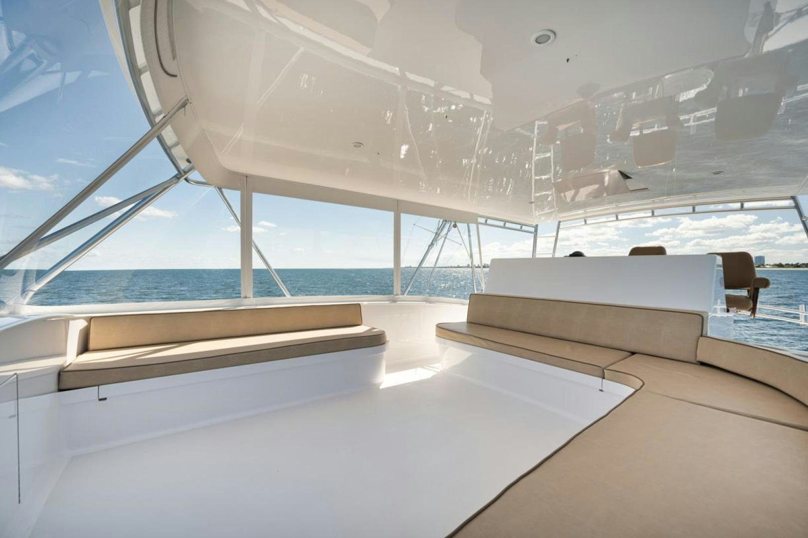 a room with a couch and a large window aboard Gina Lisa Yacht for Sale