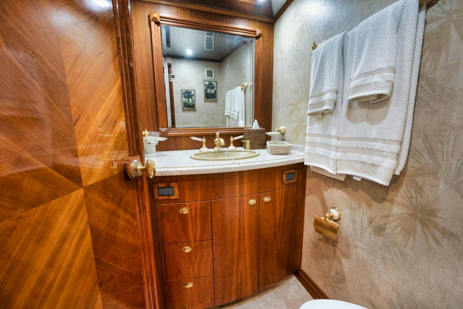a bathroom with a sink and a mirror aboard Gina Lisa Yacht for Sale