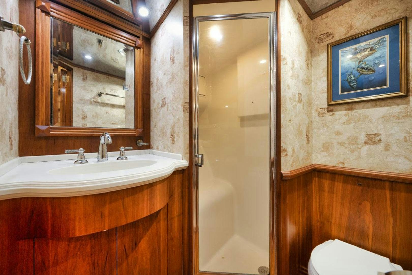 a bathroom with a sink and a mirror aboard Gina Lisa Yacht for Sale