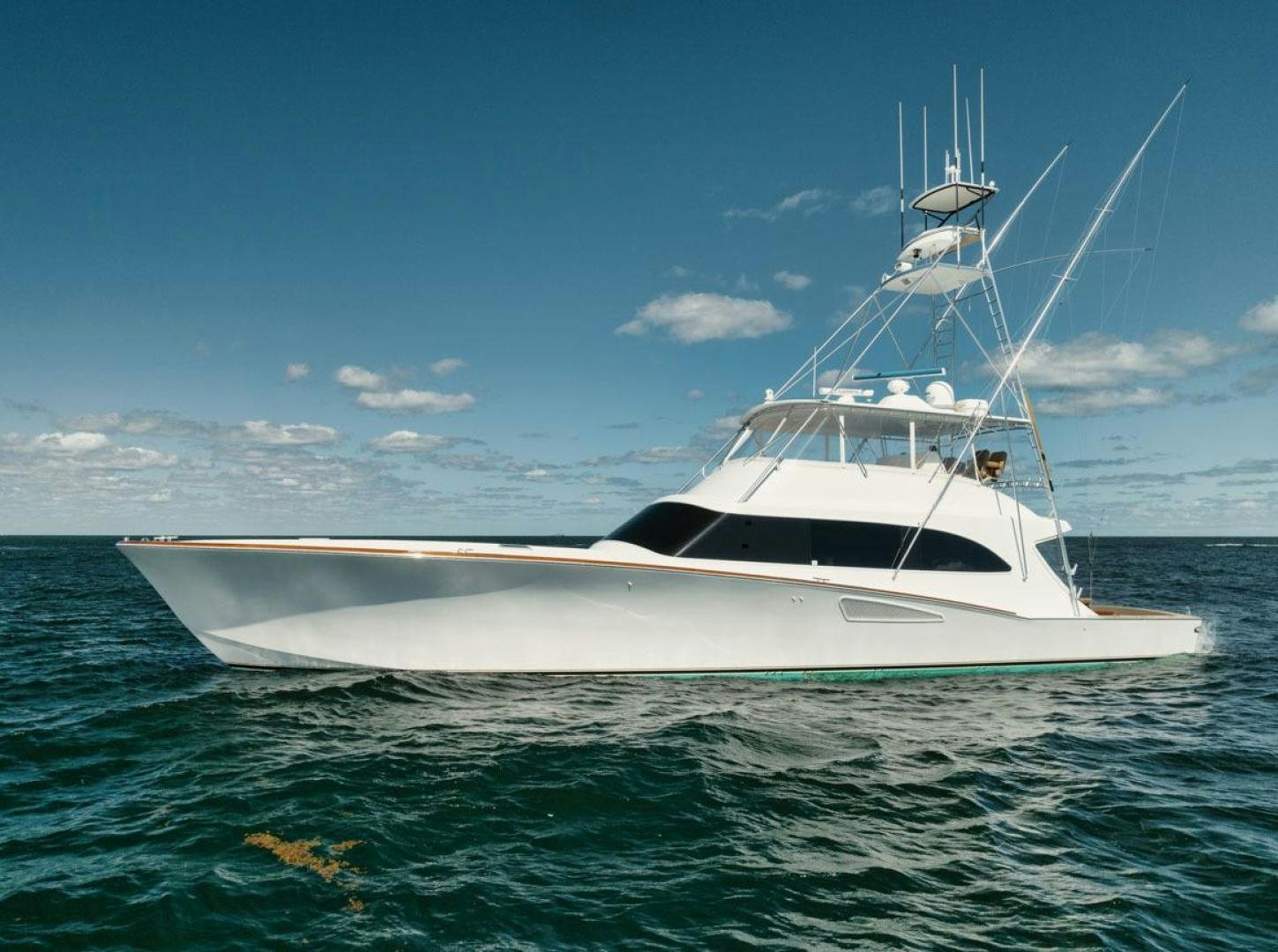 a white boat in the water aboard Gina Lisa Yacht for Sale