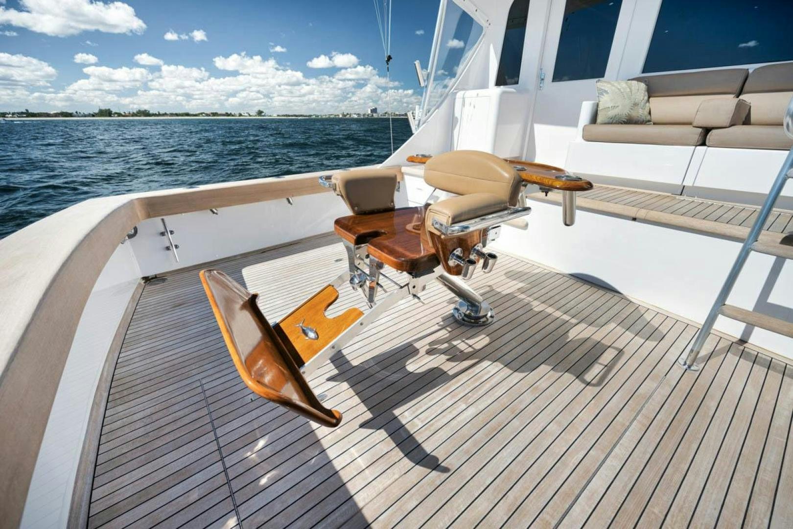 a deck with chairs on it aboard Gina Lisa Yacht for Sale