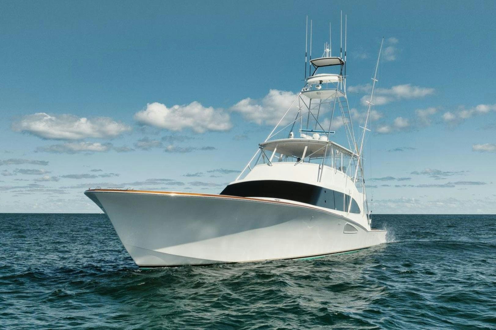 a white boat in the water aboard Gina Lisa Yacht for Sale