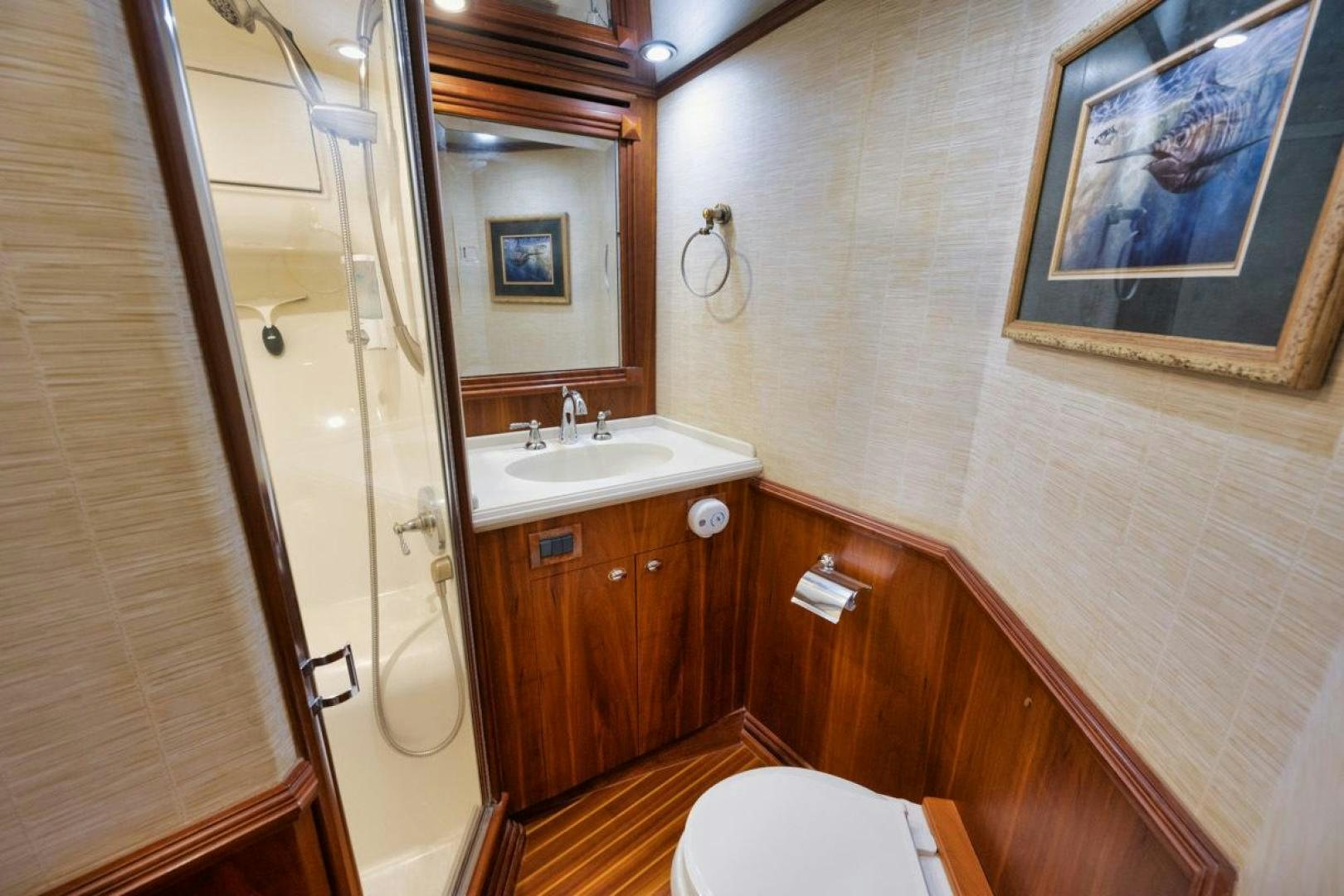 a bathroom with a shower and sink aboard Gina Lisa Yacht for Sale