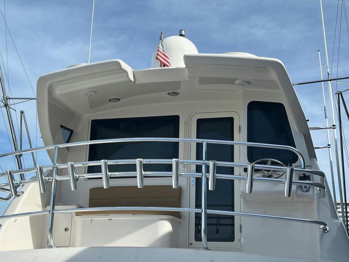 a boat with a flag on the front aboard ROFO Yacht for Sale
