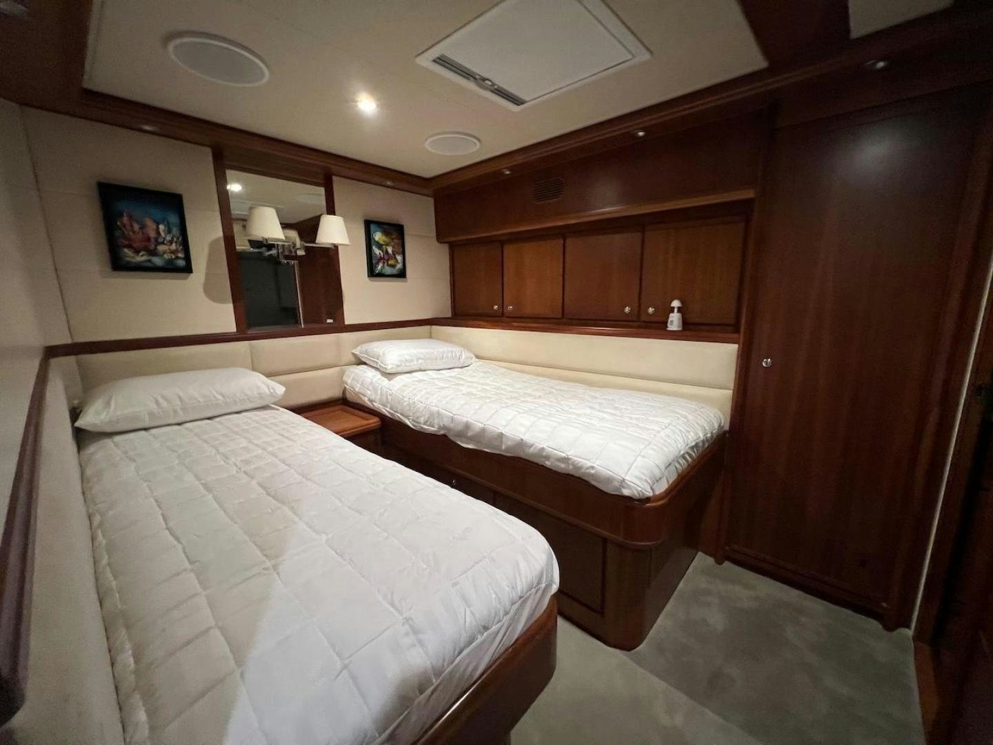 a room with two beds aboard ROFO Yacht for Sale