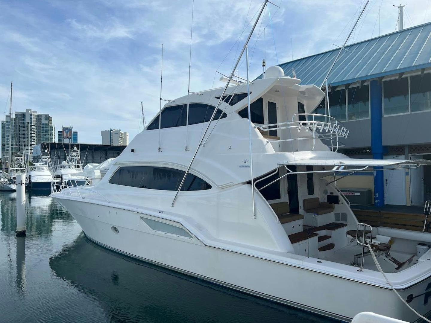 a white yacht docked aboard ROFO Yacht for Sale