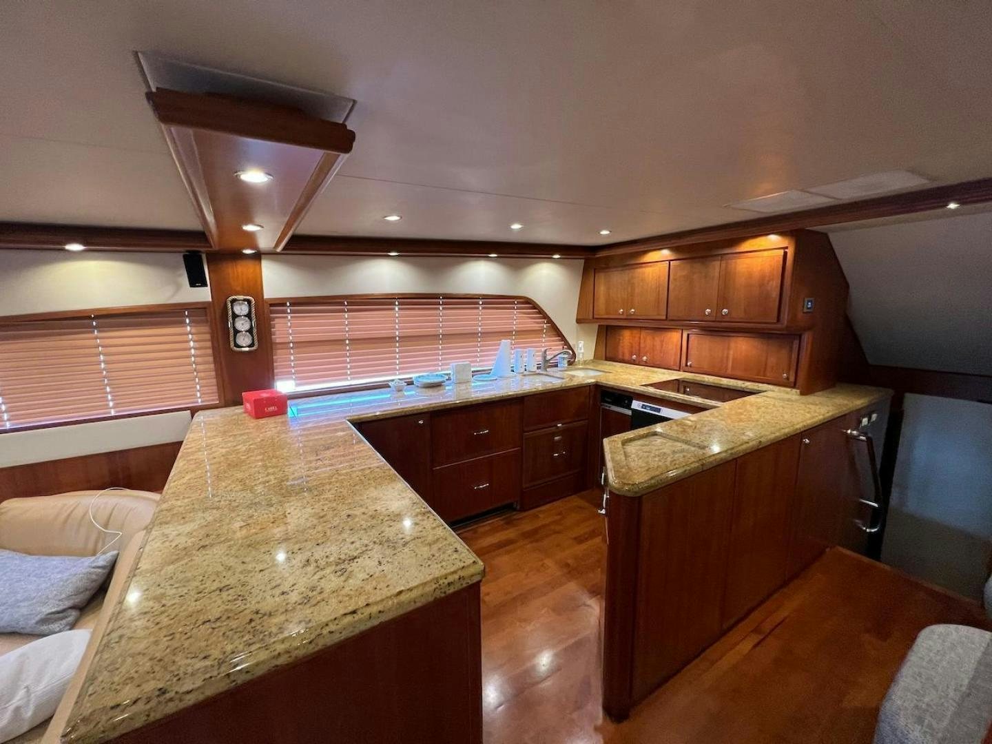 a kitchen with wooden cabinets aboard ROFO Yacht for Sale