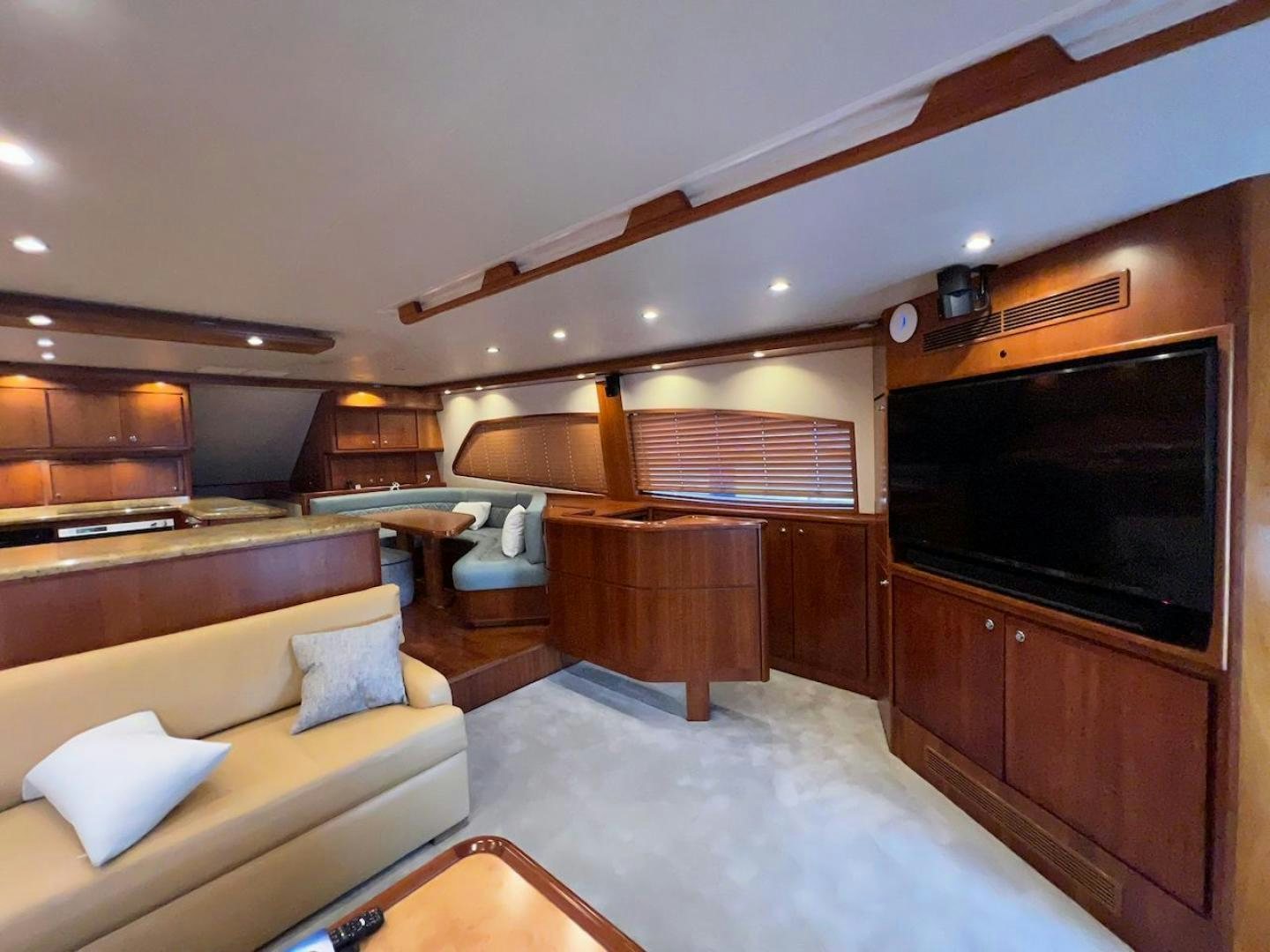 a living room with a tv and furniture aboard ROFO Yacht for Sale
