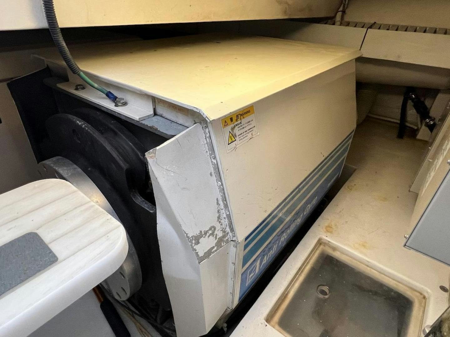 a machine with a large piece of paper on the top aboard ROFO Yacht for Sale