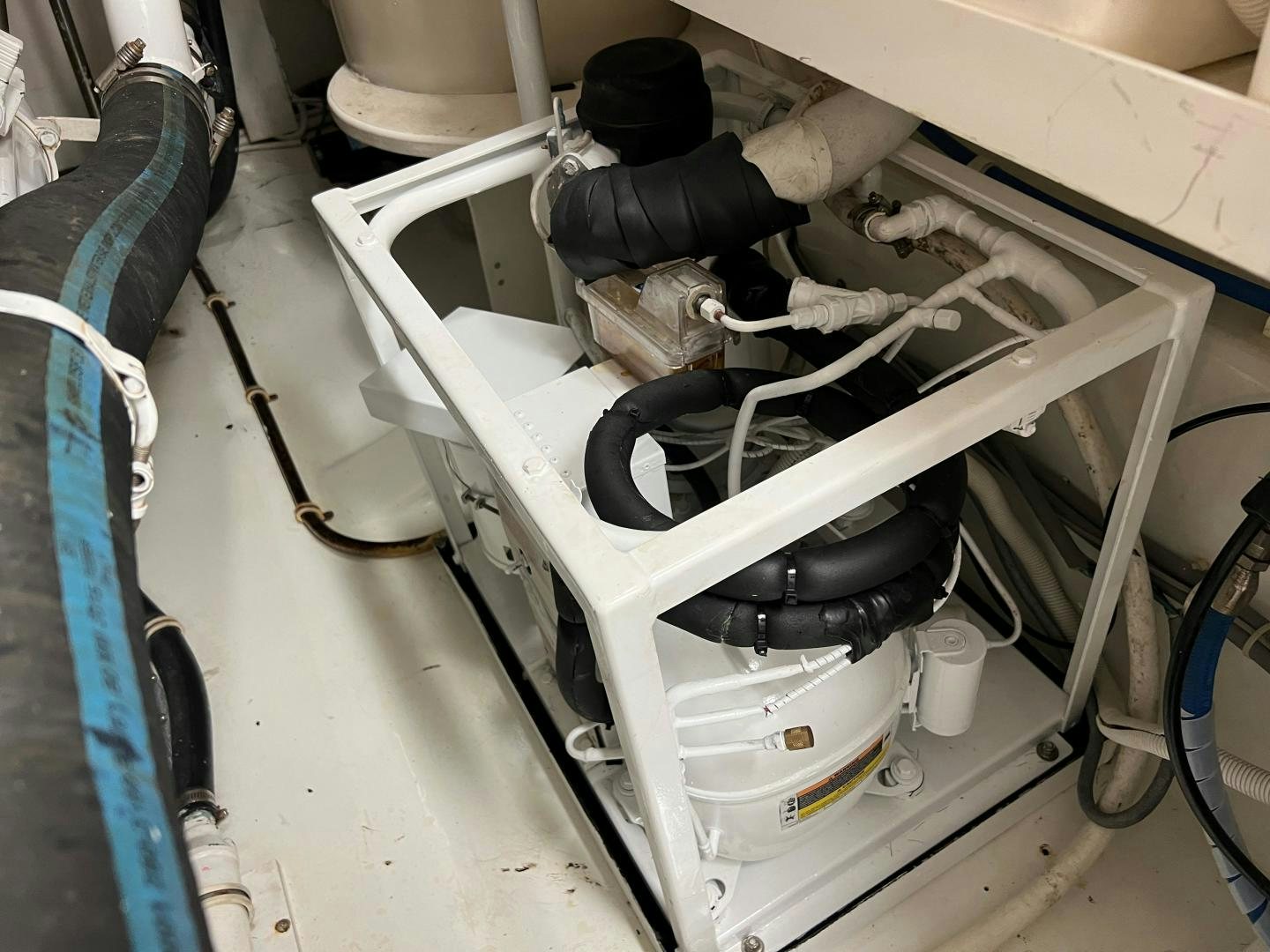 a white machine with a black handle aboard ROFO Yacht for Sale