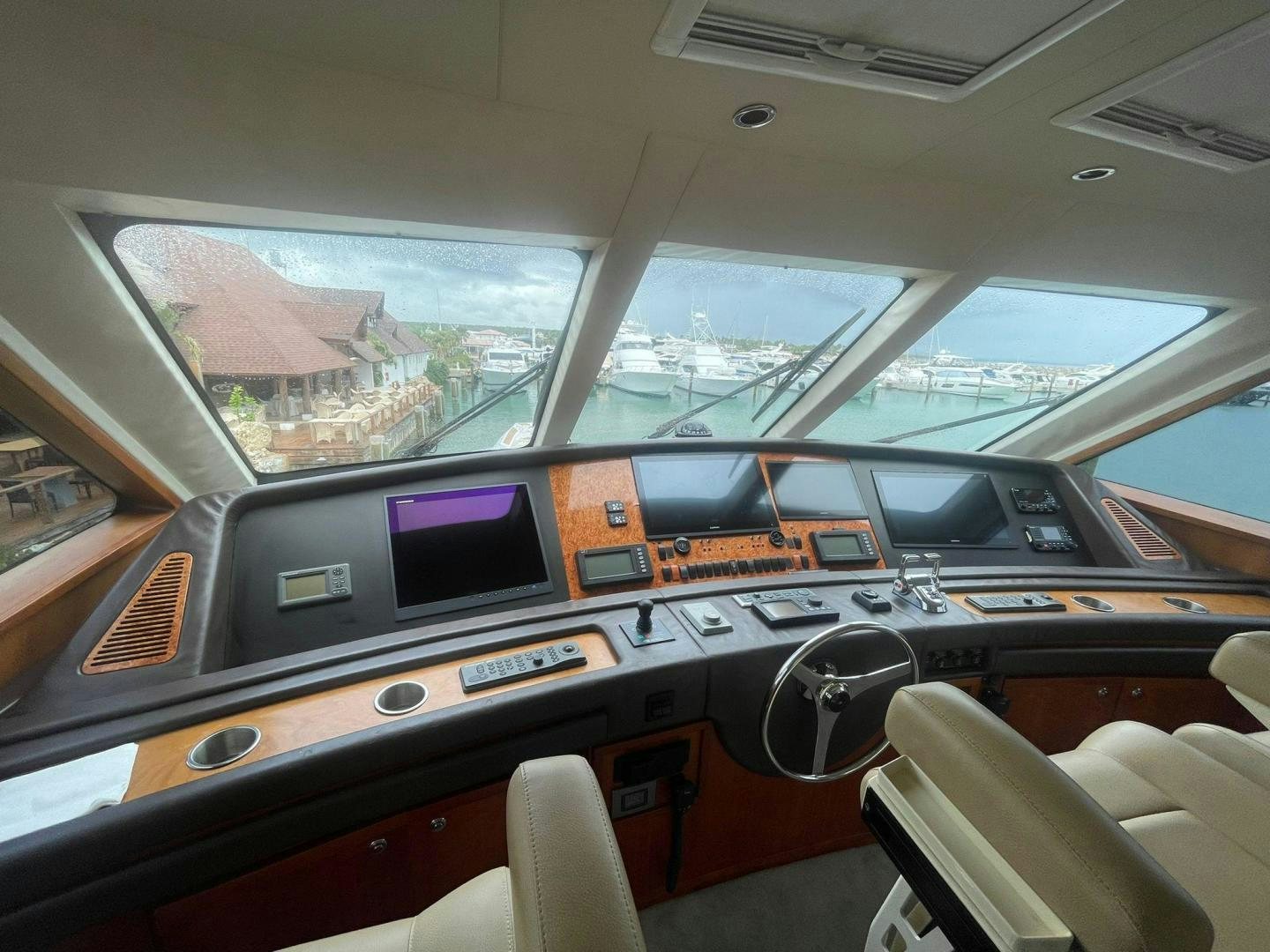inside of a vehicle with a view of the city below aboard ROFO Yacht for Sale