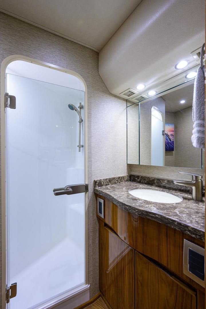 a bathroom with a sink and a mirror aboard TORO Yacht for Sale