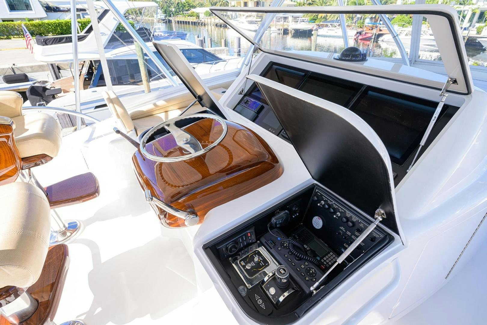 a close-up of a steering wheel and dashboard of a car aboard TORO Yacht for Sale