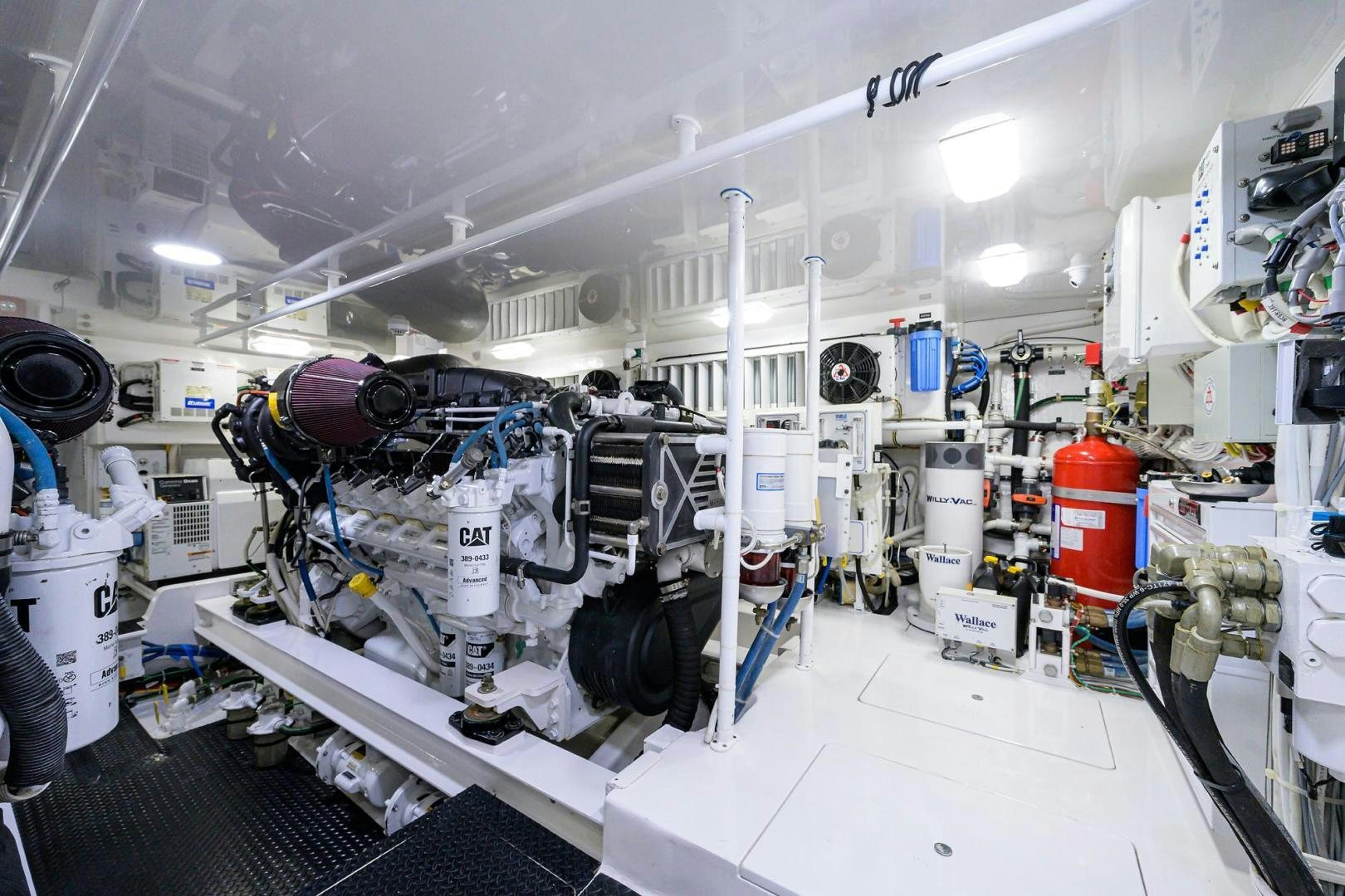 a large white machine with many black and white pipes aboard TORO Yacht for Sale